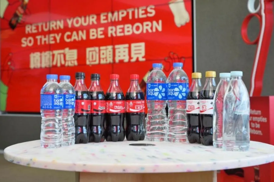 A group of plastic bottles on a table.